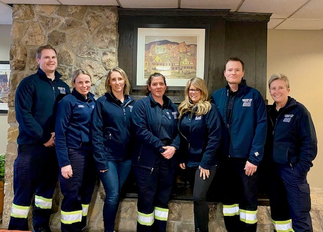 Group photo of 7 paramedics standing together 