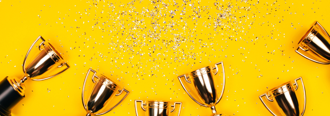 trophies on yellow background